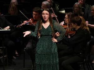 Shannon Engel performs a solo during a music production. 